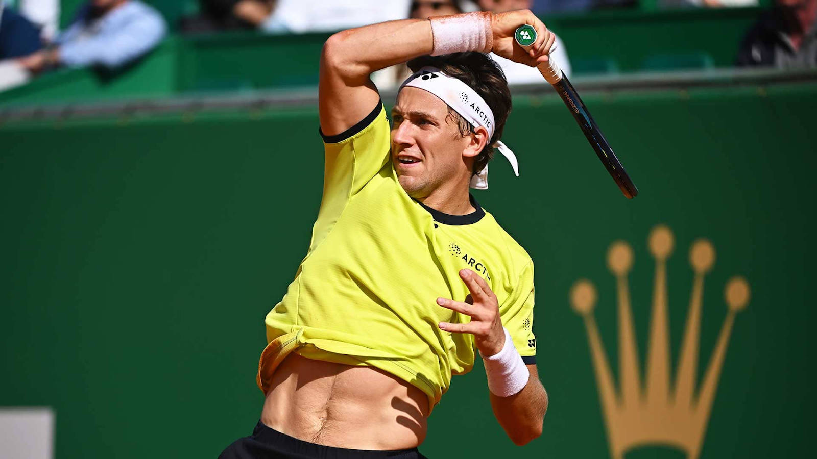 Casper Ruud In Action During A Tennis Match Background