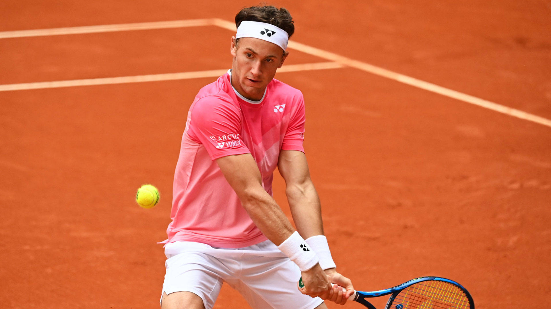 Casper Ruud In Pink Shirt Background