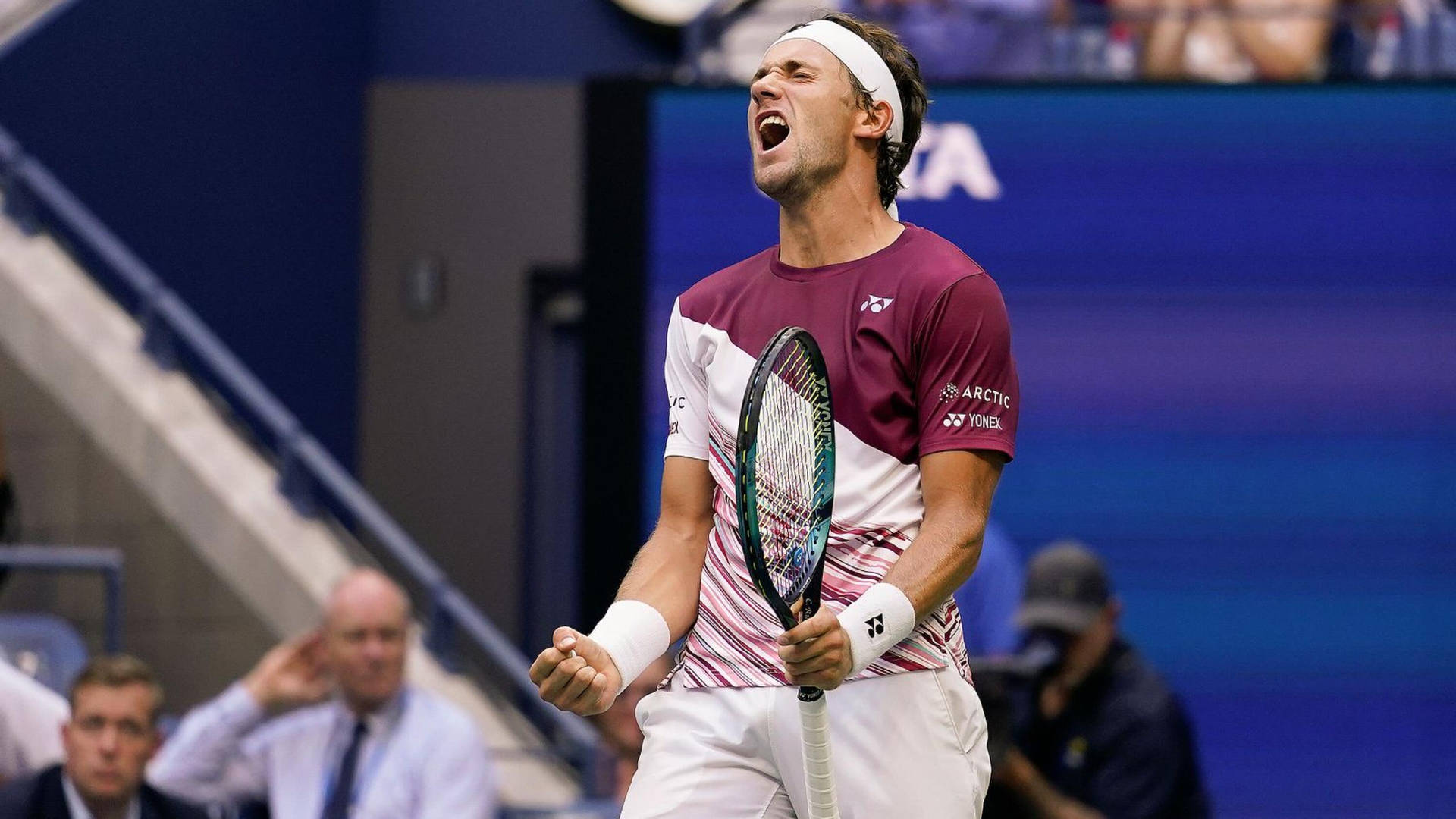 Casper Ruud Screaming While Holding His Racket Background