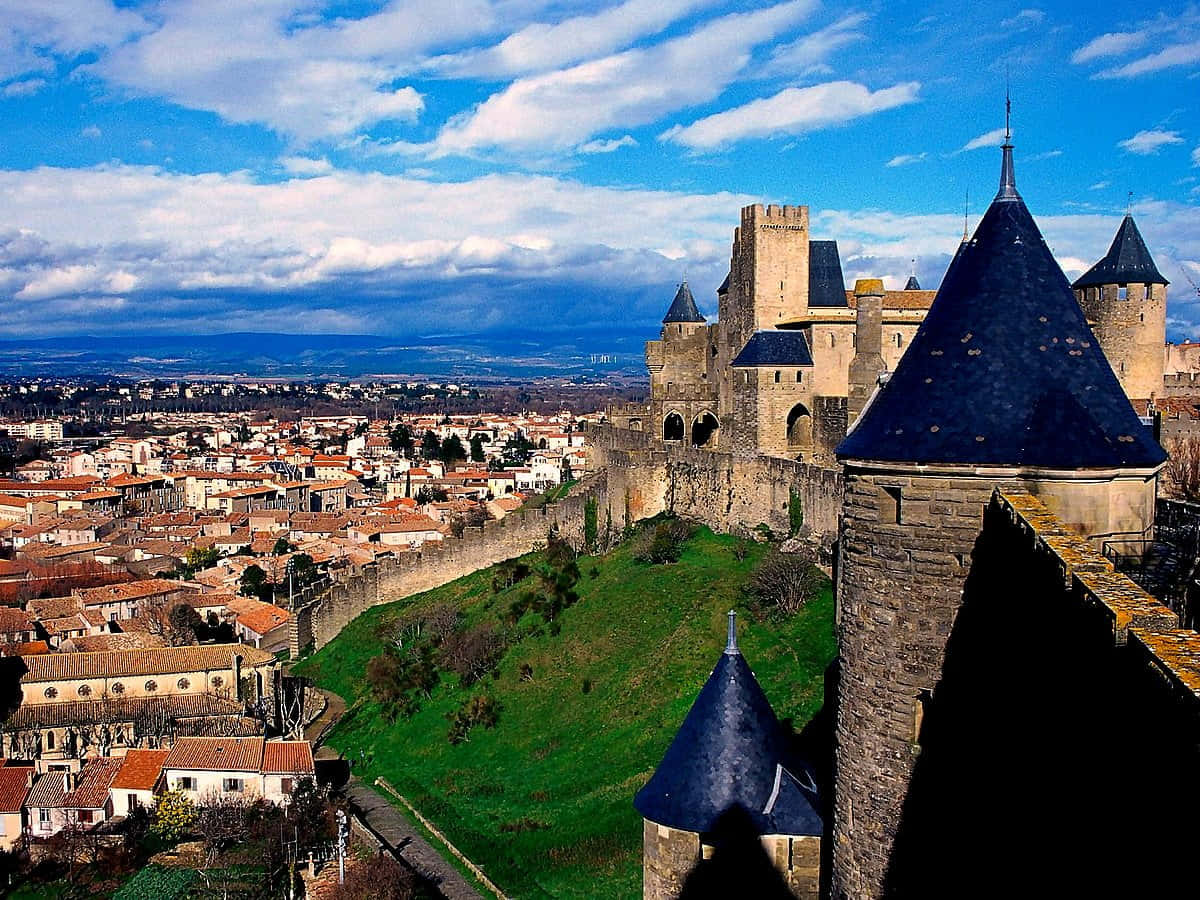 Castle And La Bastide Saint Louis In Carcassonne Background