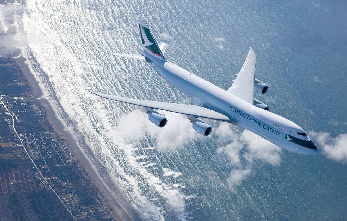 Cathay Pacific Plane Seashore Background