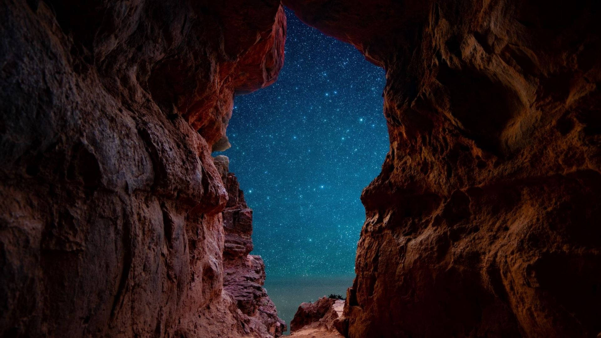 Cave Under Starry Sky Background