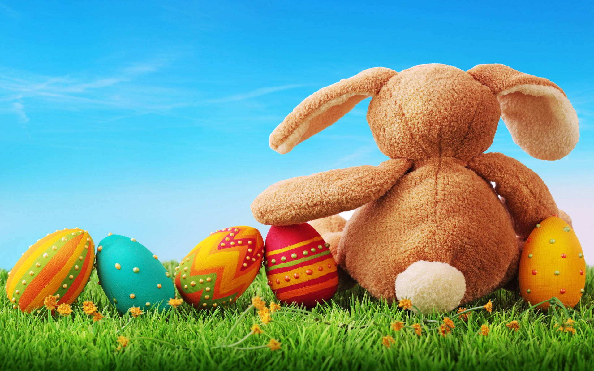 Celebrate Easter With Joyful Bunny And Colored Eggs Background