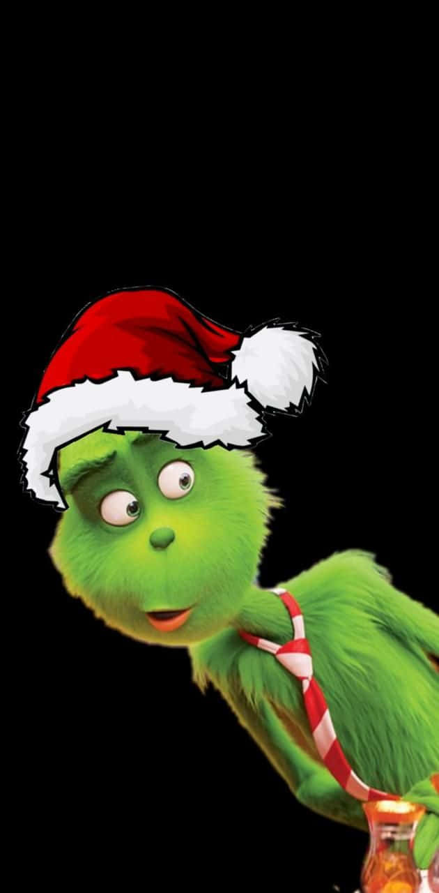 Celebrate The Holidays With A Cute Grinch Background