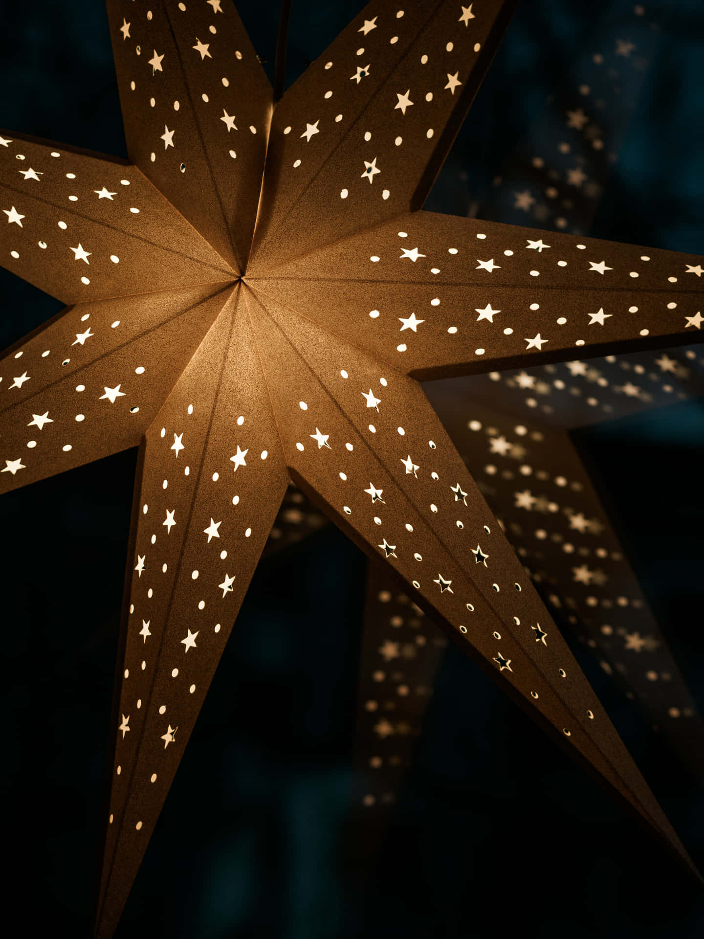 Celebrate The Holidays With A Glowing Christmas Star Background