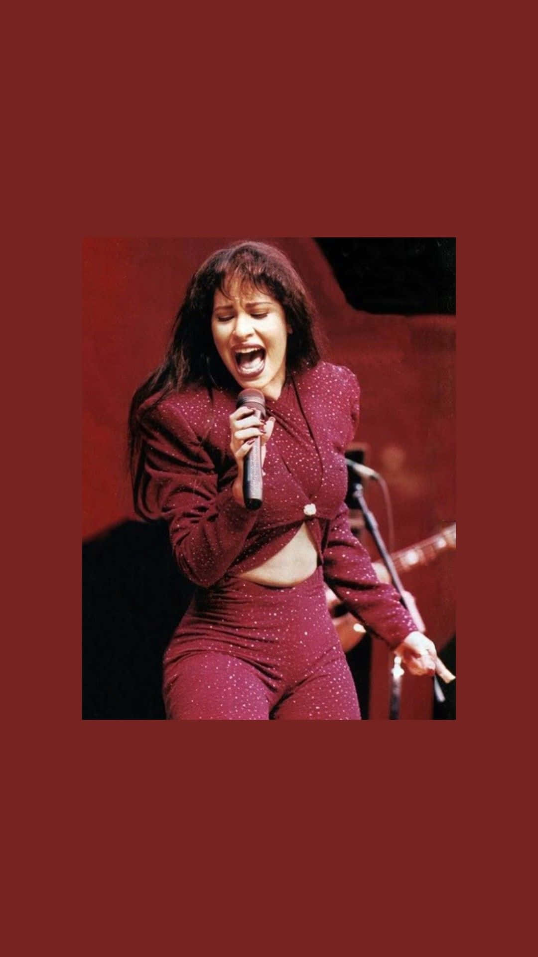 Celebrate The Music Of Selena Quintanilla With This Fiery Iphone Wallpaper Background