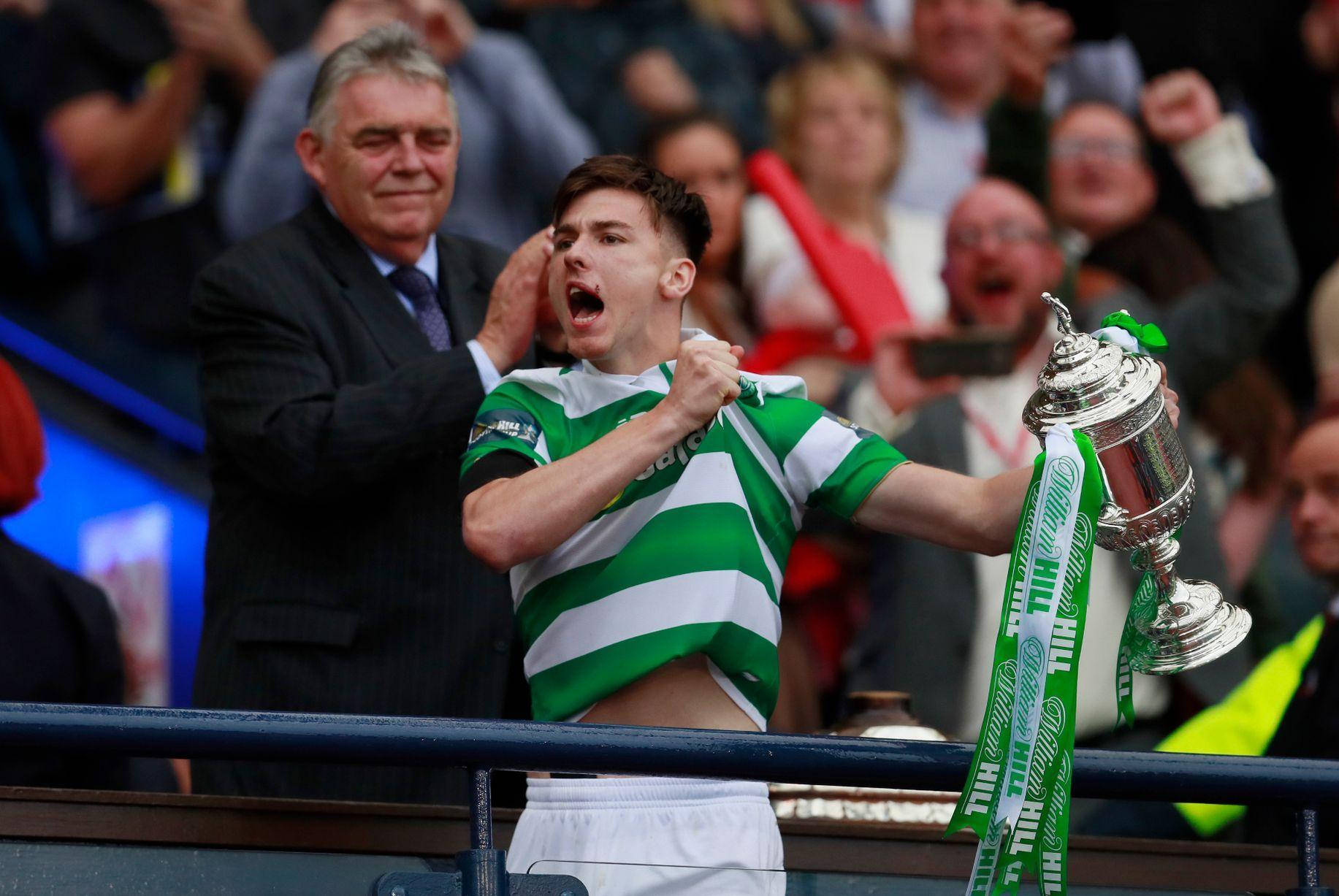 Celebrating Kieran Tierney With Trophy Background