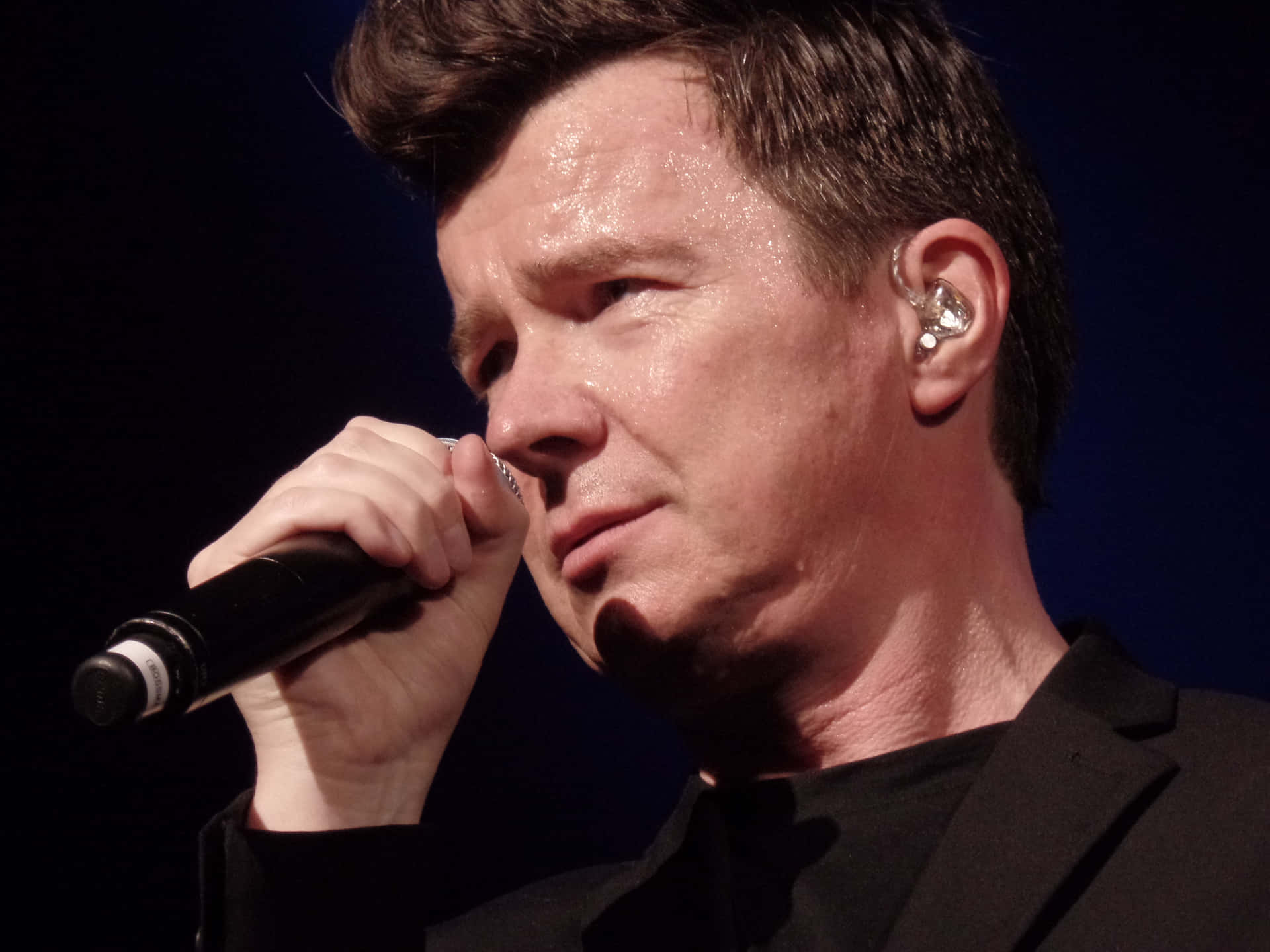 Celebrating The Music Of Legendary Singer And Songwriter Rick Astley Background