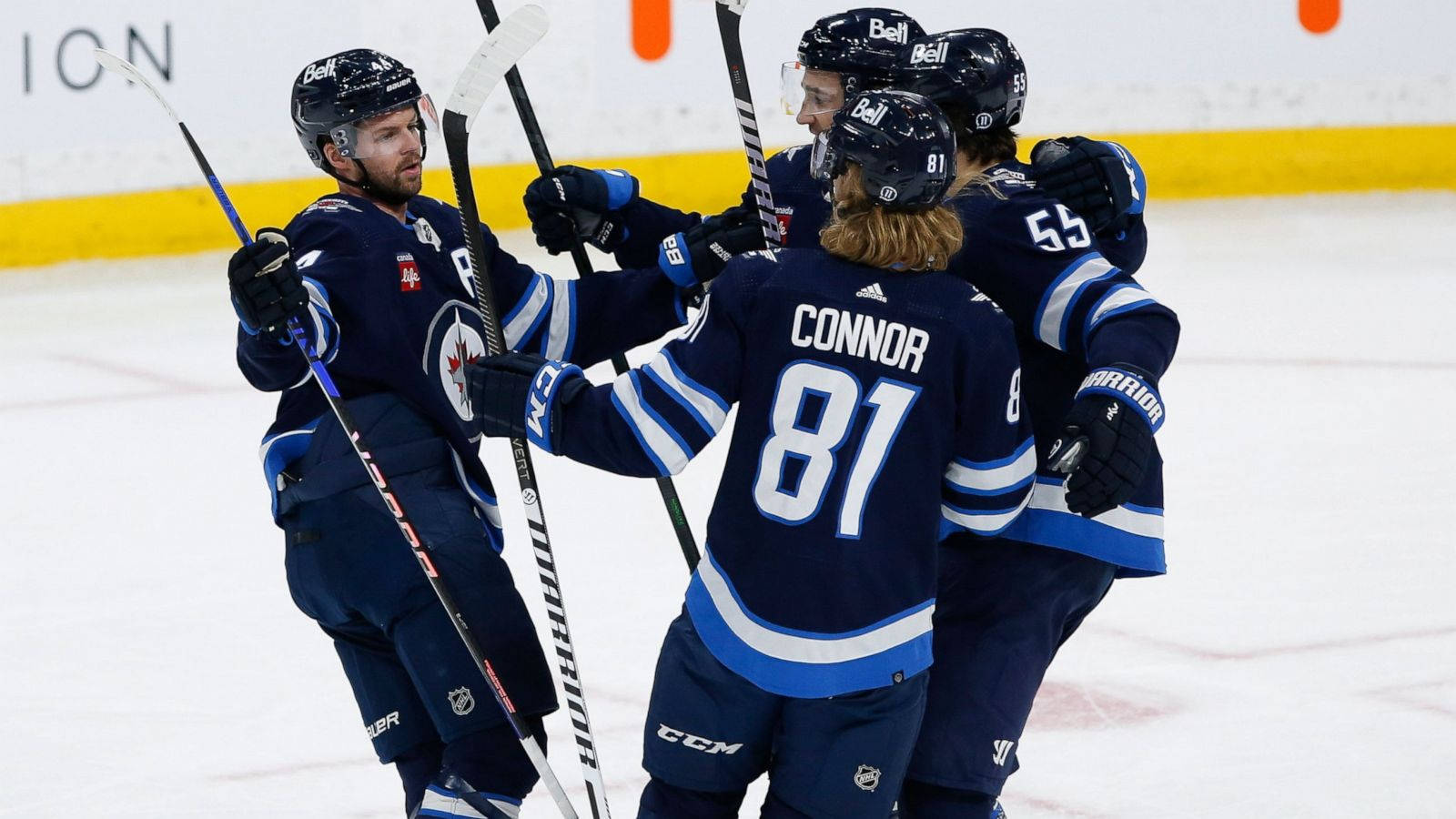 Celebrating Winnipeg Jets Kyle Connor And Teammates Background