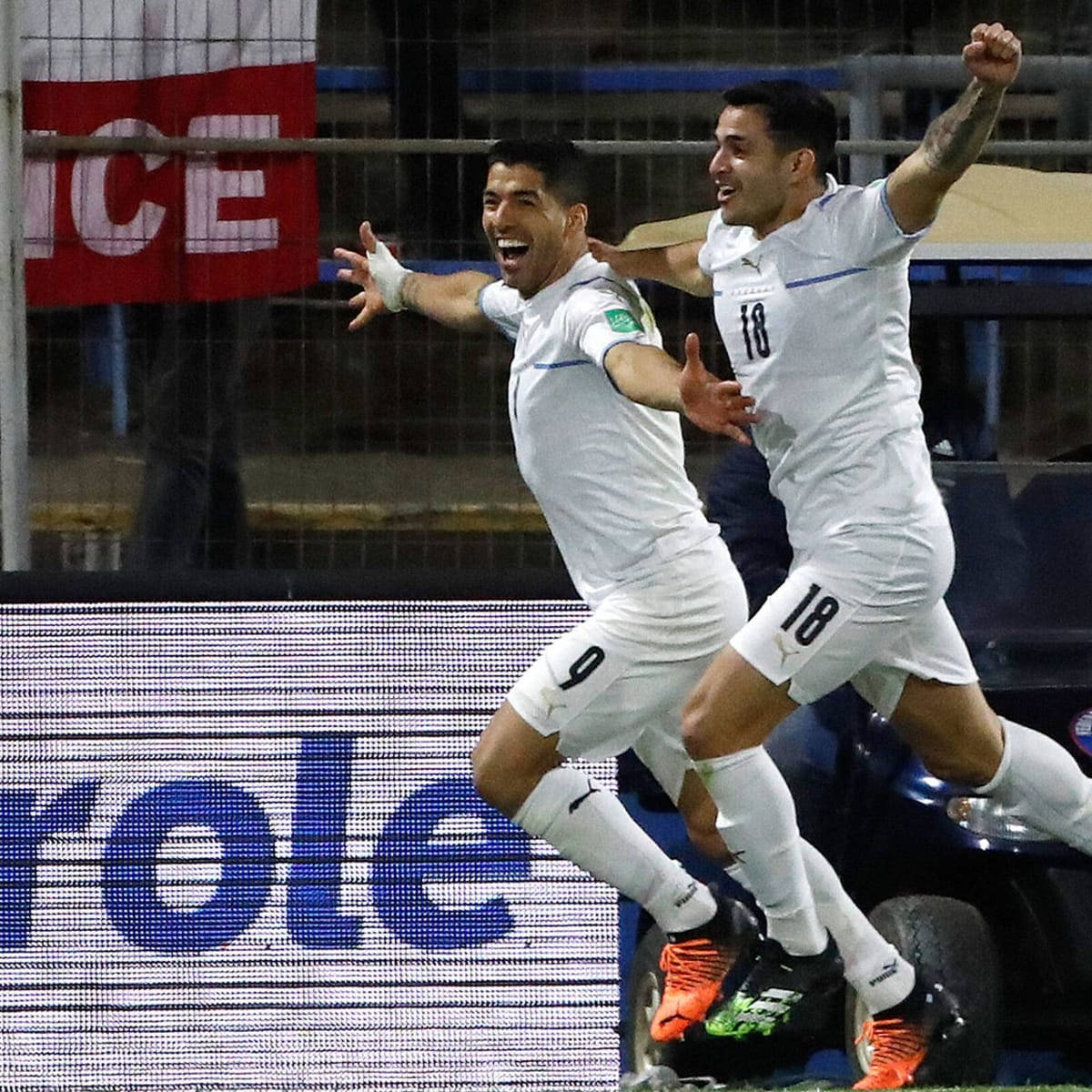 Celebratory Moment With Luis Suarez And Gomez In Uruguay National Football Team Background