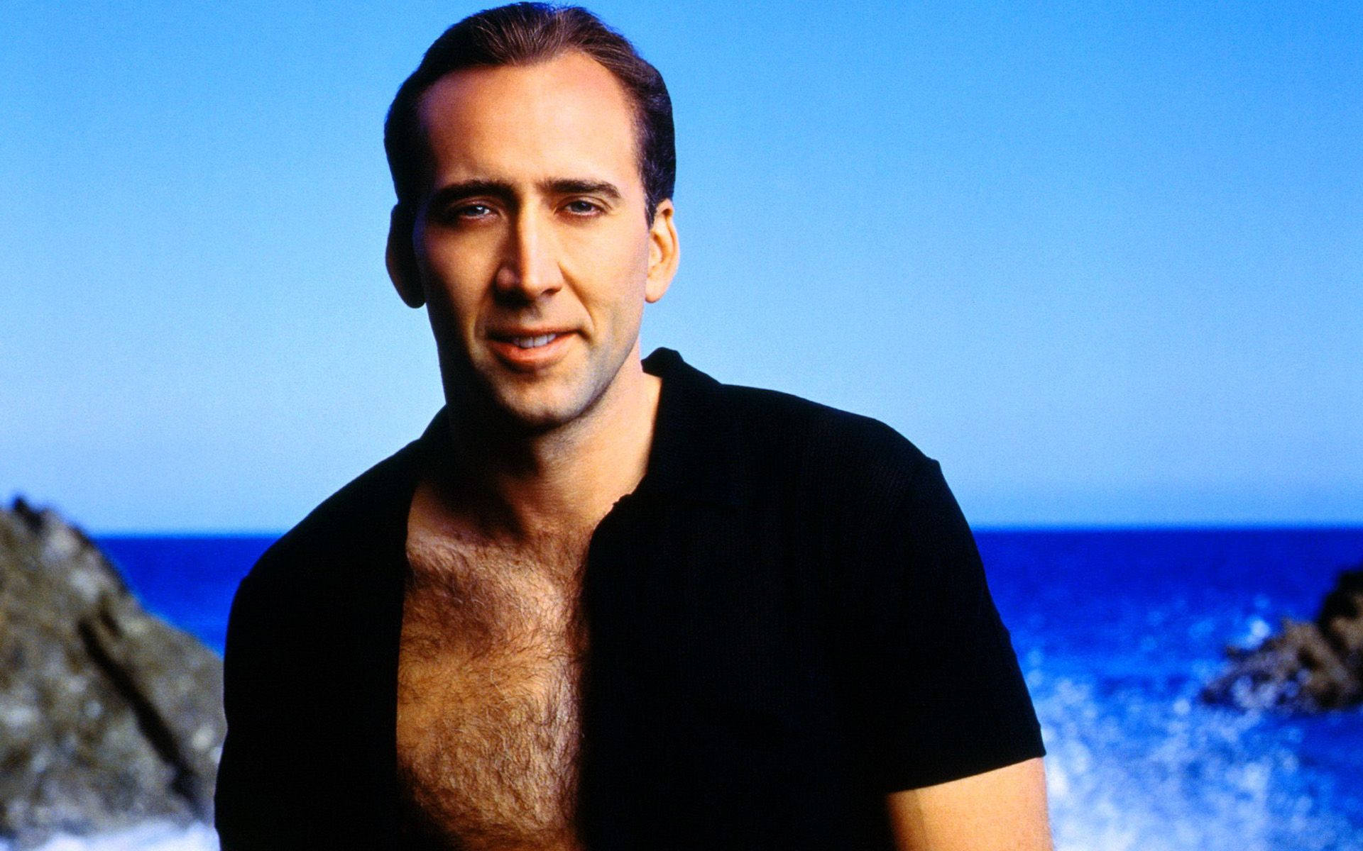 Celebrity Nicolas Cage At The Sea Background
