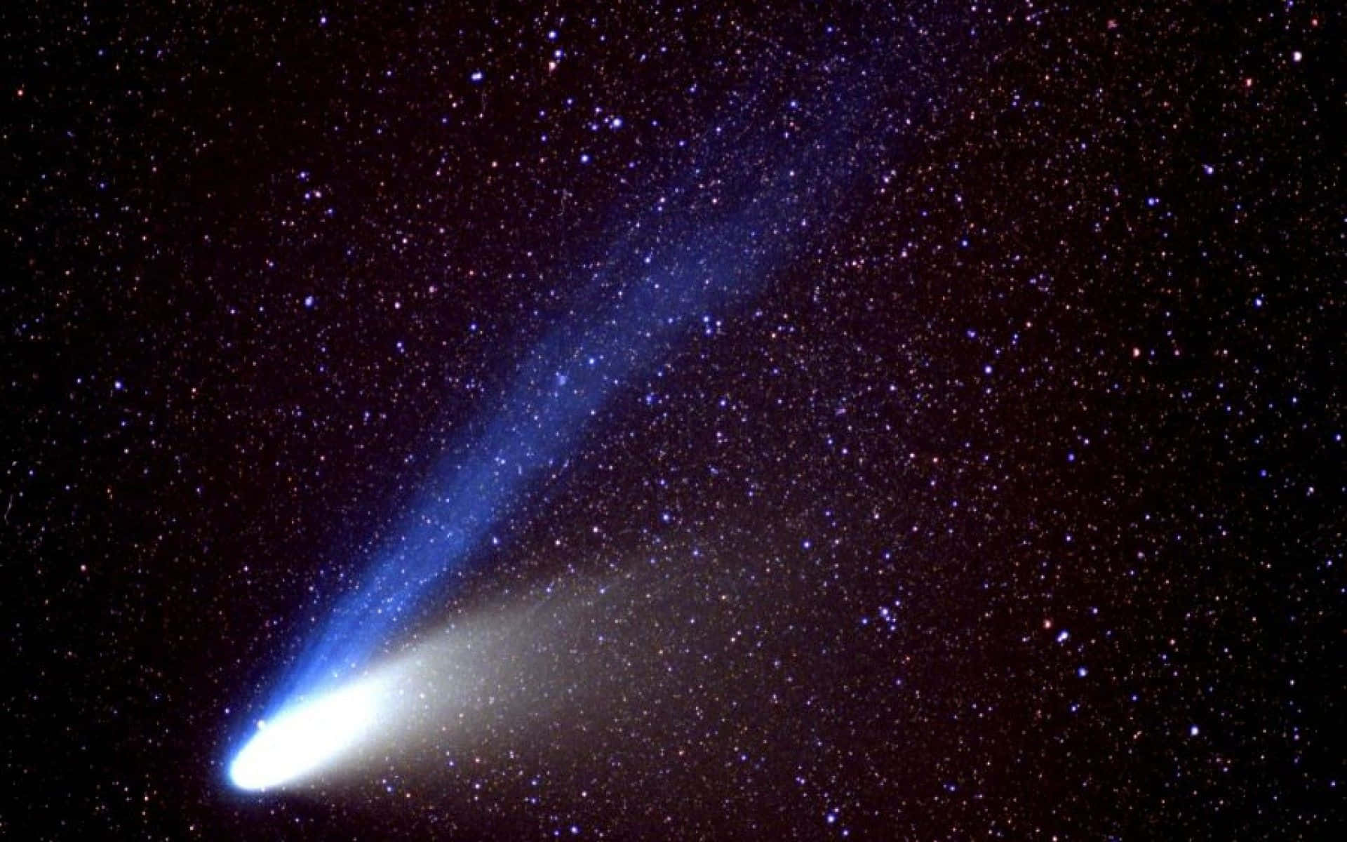 Celestial Show - Stunning Comet Lighting Up The Night Sky Background