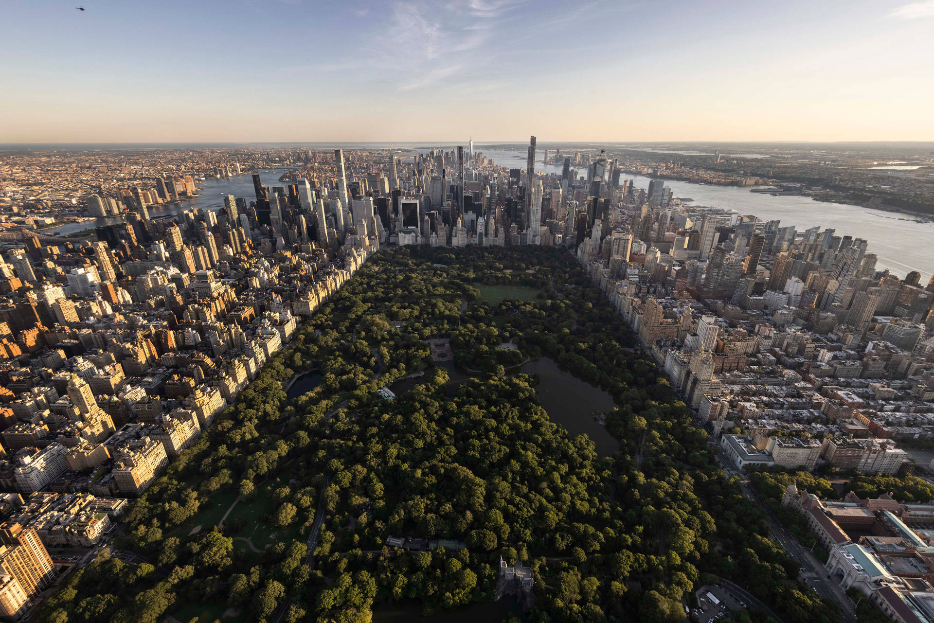 Central Park Surrounded By Buildings In New York Background