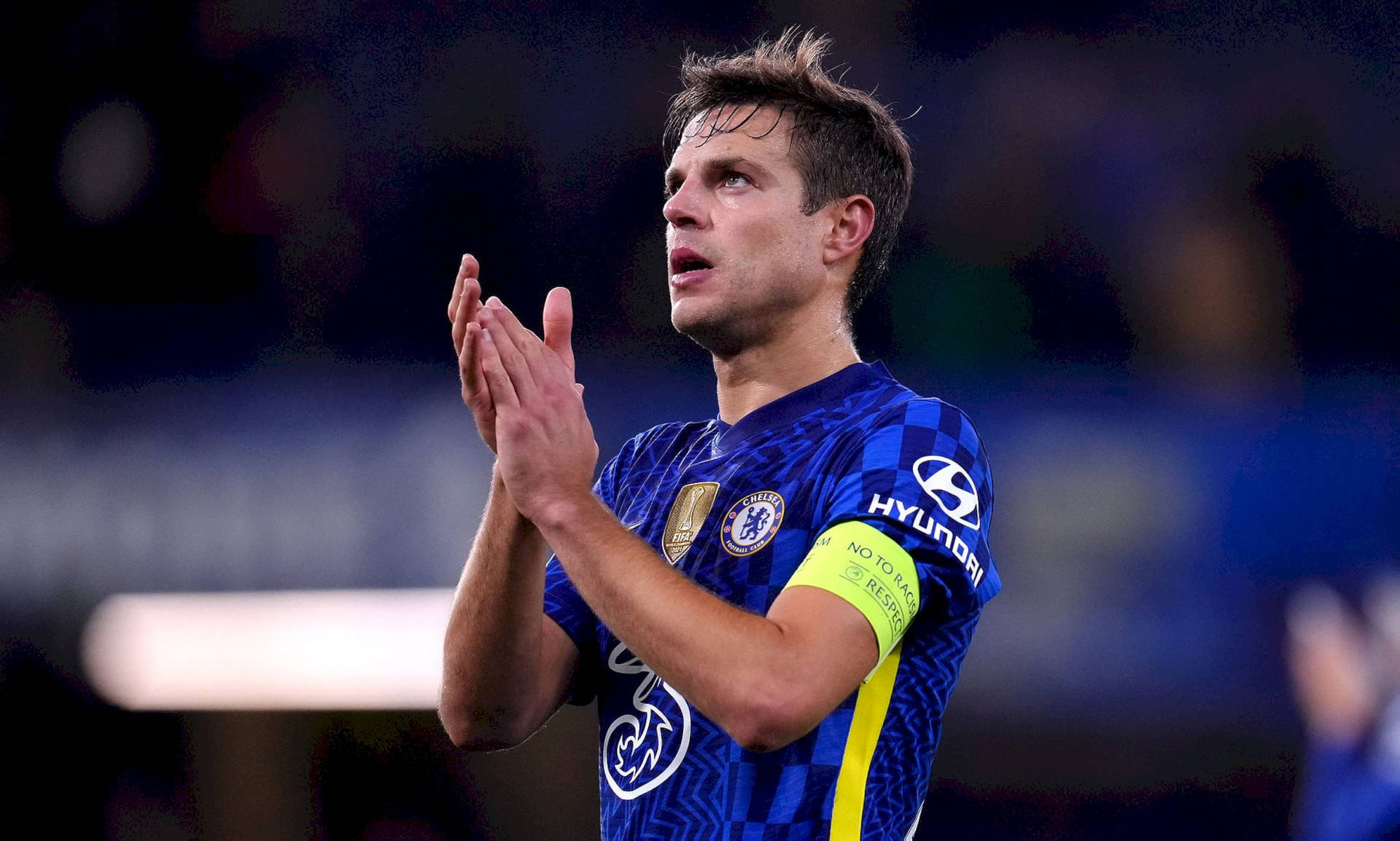 César Azpilicueta Clapping While Looking Up Background