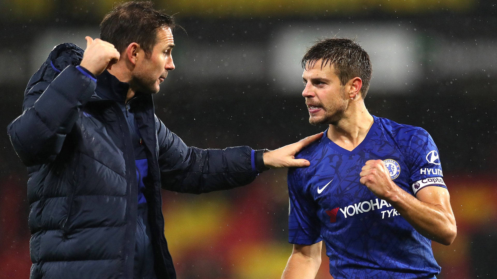 César Azpilicueta Fist Pump In Rain Background