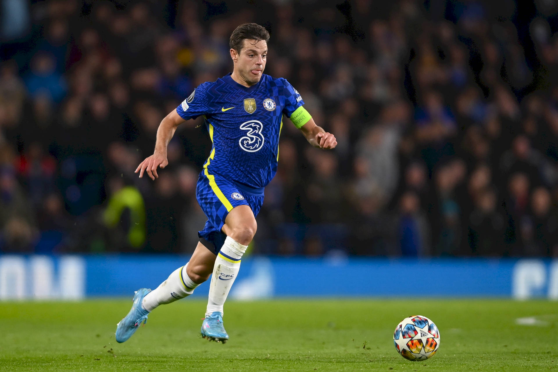 César Azpilicueta Running Across Field Background