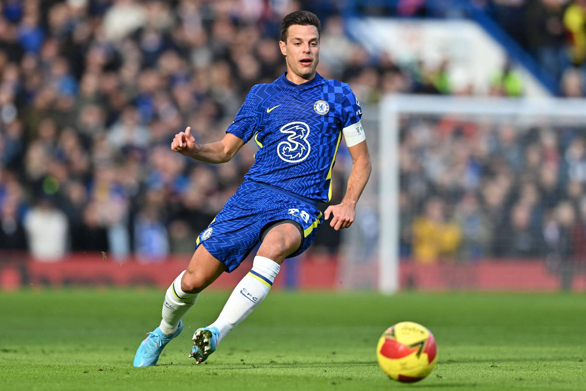 César Azpilicueta Running After Football Background