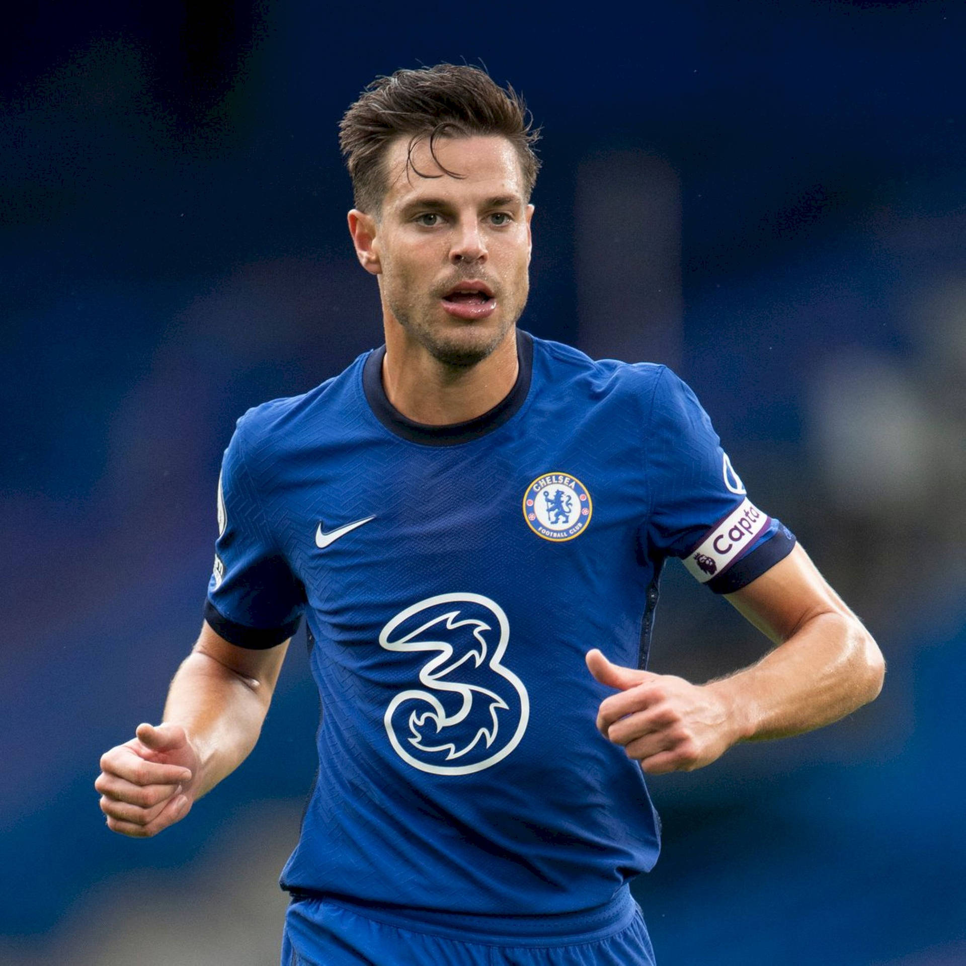 César Azpilicueta Running In Blue Jersey Background