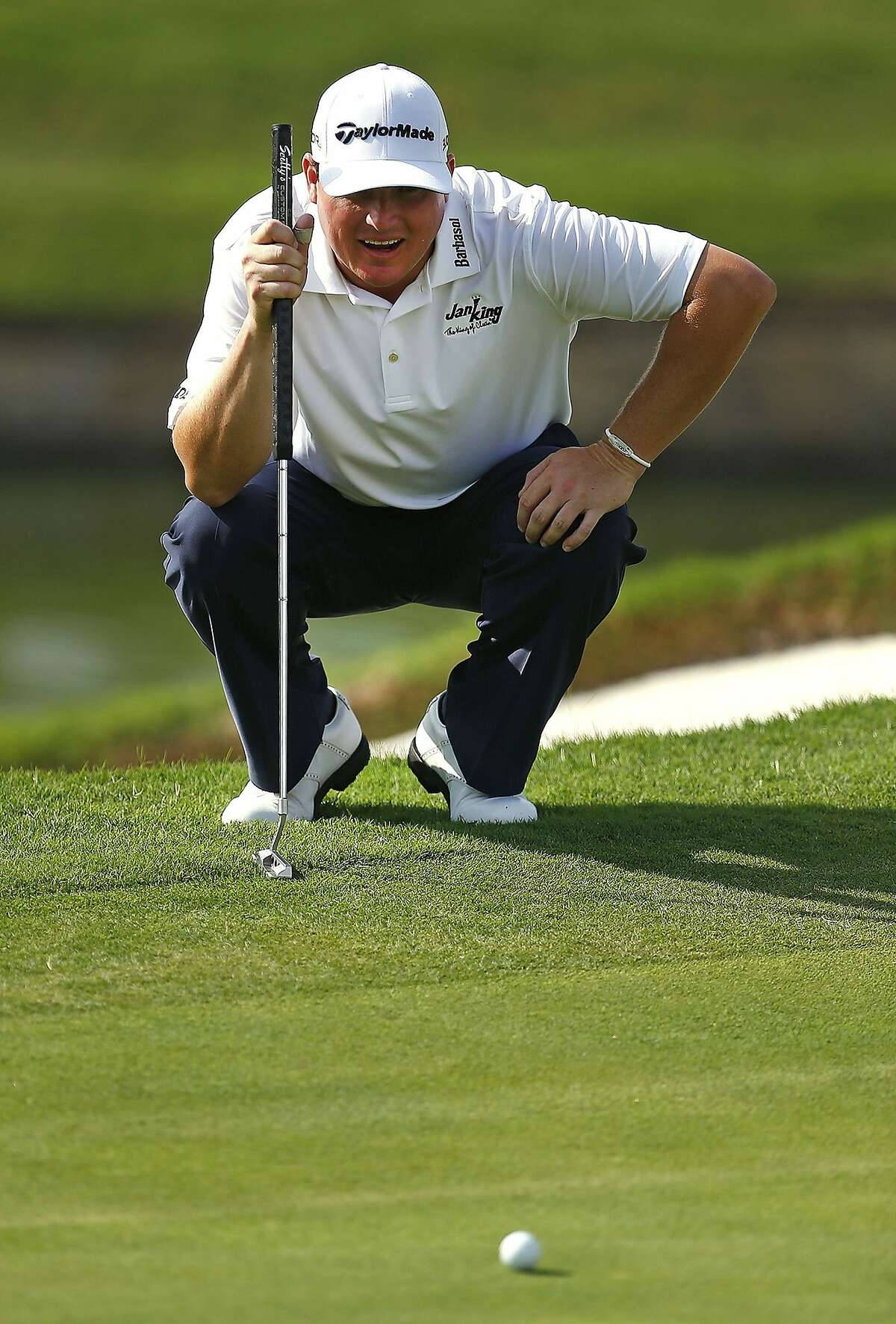 Chad Campbell Focused On His Ball In Golf Game Background