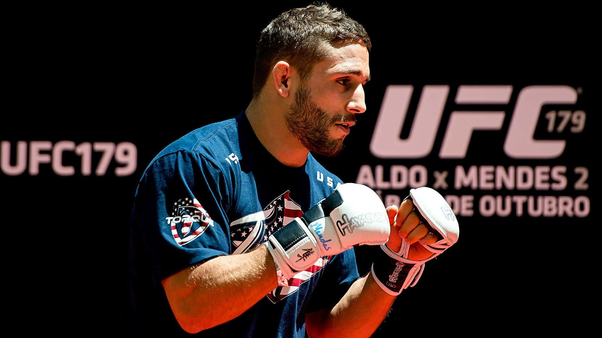 Chad Mendes In Intense Ufc 179 Fight Action Background