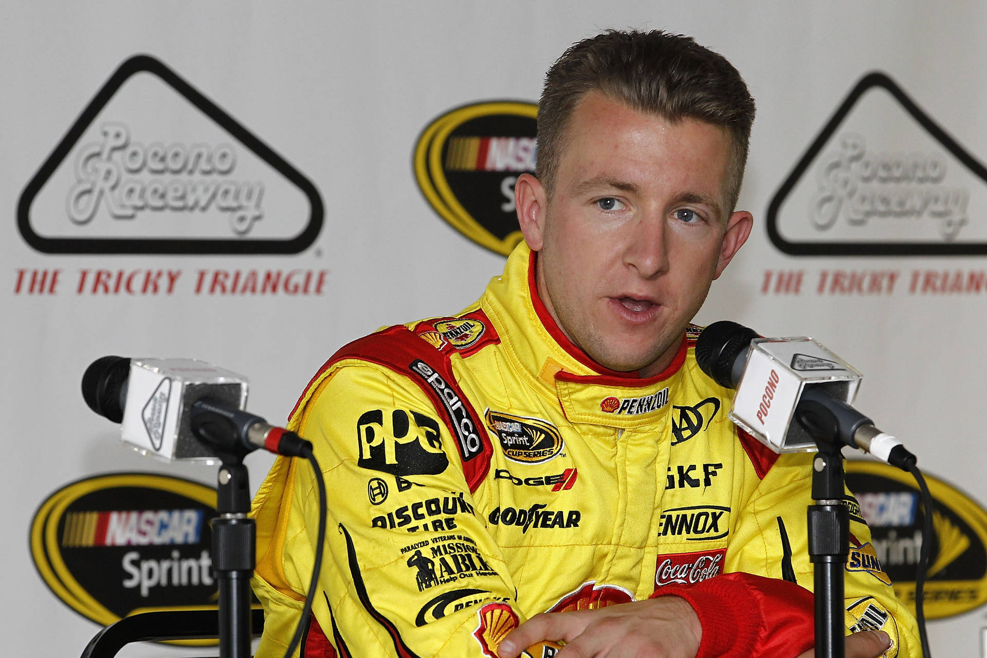 Champion Car Racer, Aj Allmendinger, Keenly Answering Journalist Queries. Background