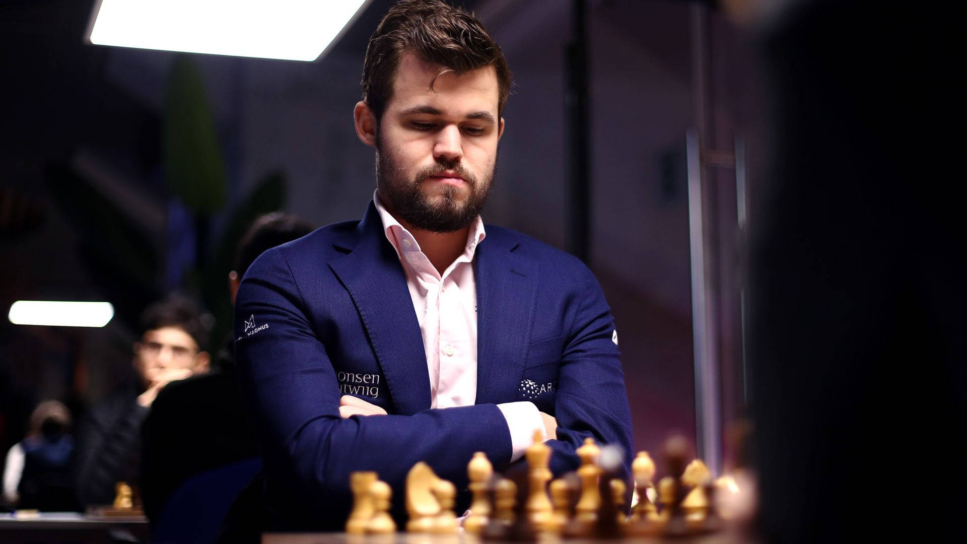 Champion Chess Player Magnus Carlsen In Concentrated Pose Background