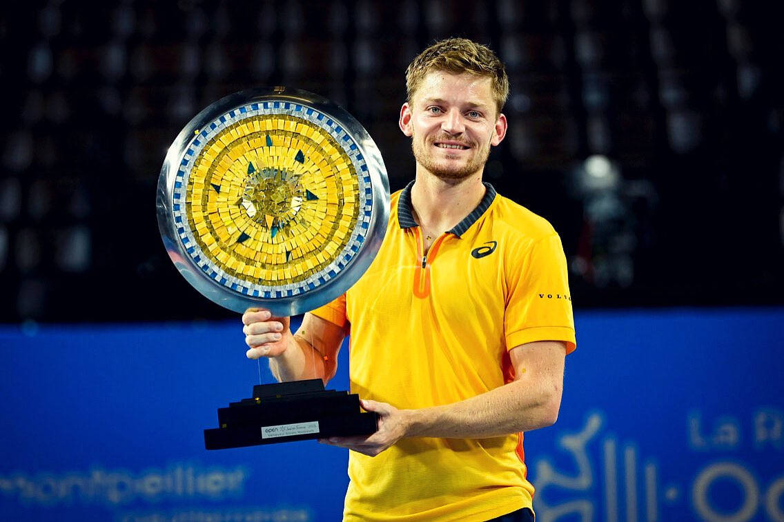 Champion David Goffin With His Trophy Background