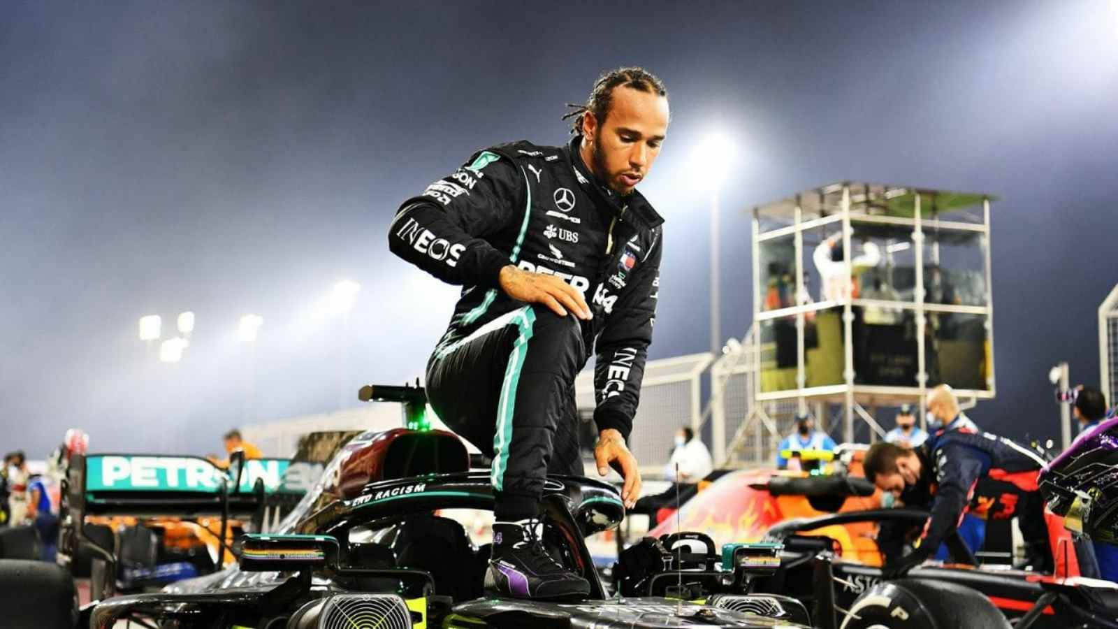 Champion F1 Driver Lewis Hamilton Stepping Out Of His Race Car