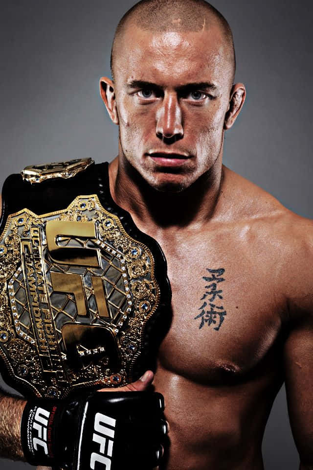 Champion Georges St-pierre, Reigning Ufc Title Holder With His Belt