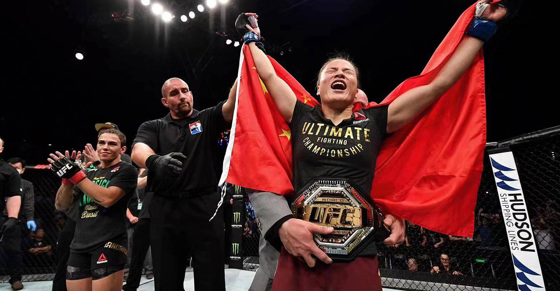 Champion Zhang Weili Proudly Displaying Her Ufc Belt. Background