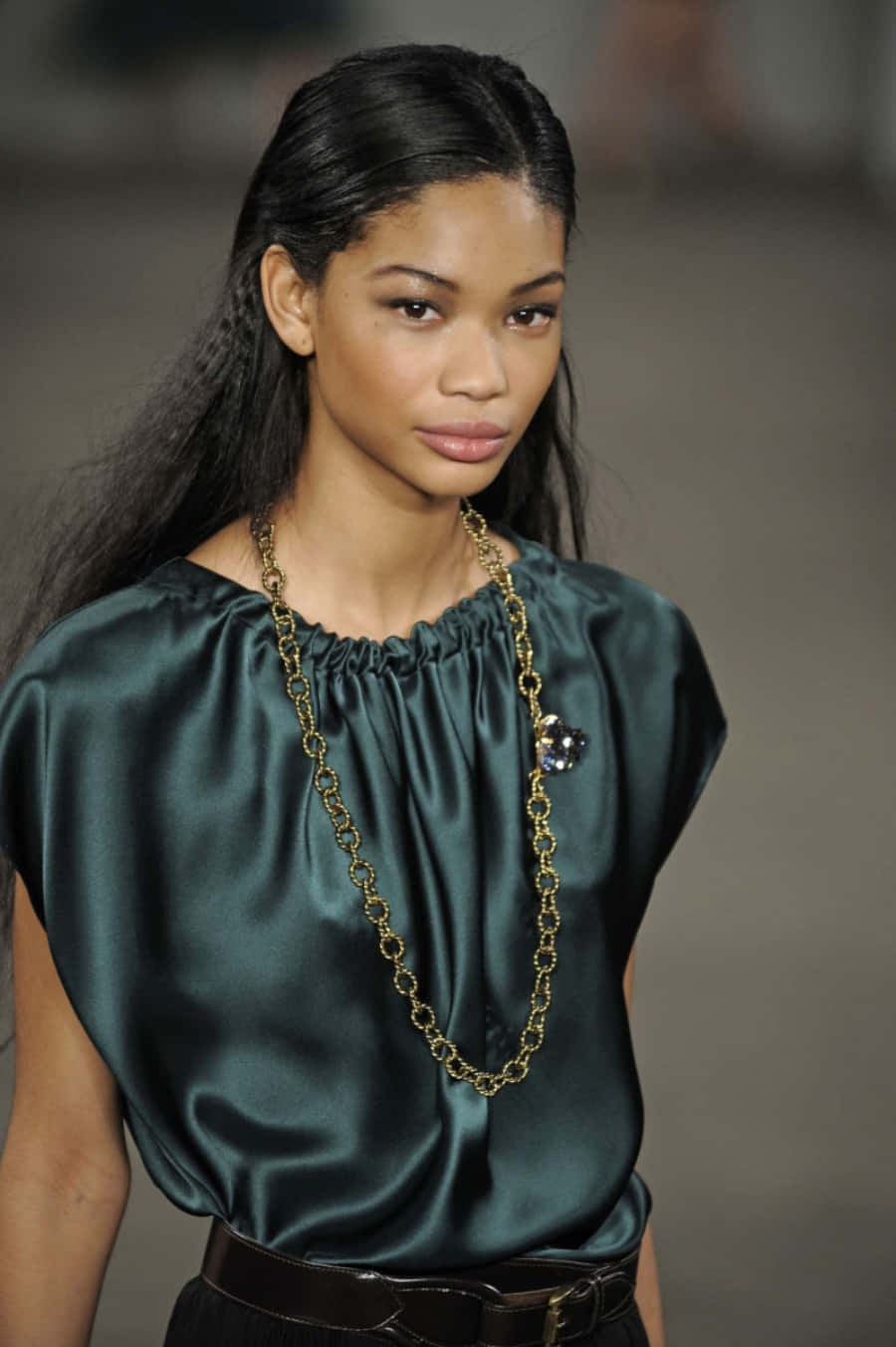 Chanel Iman In A Striking Pose On The Catwalk Background