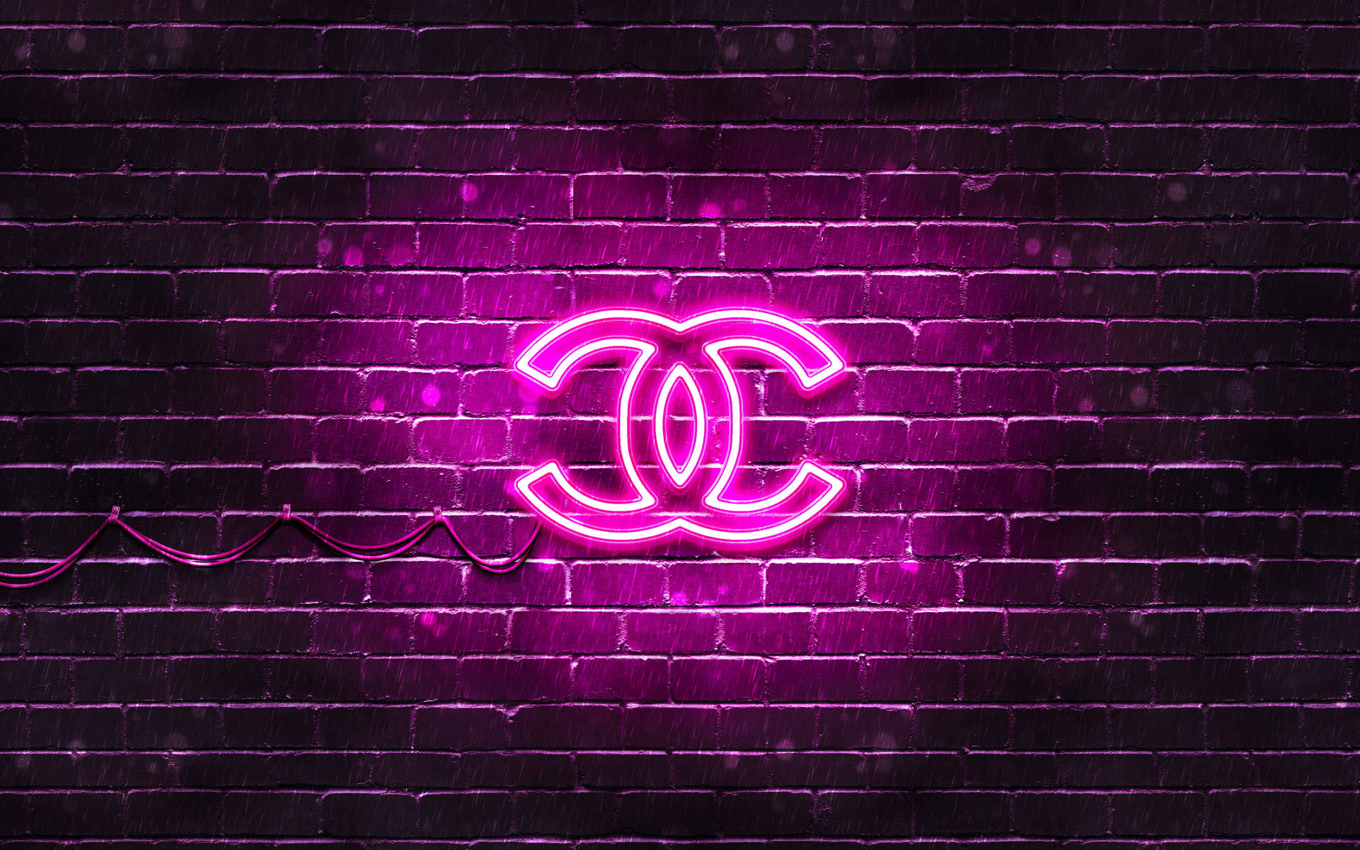 Chanel's Iconic Logo In Pink Neon Lights Background