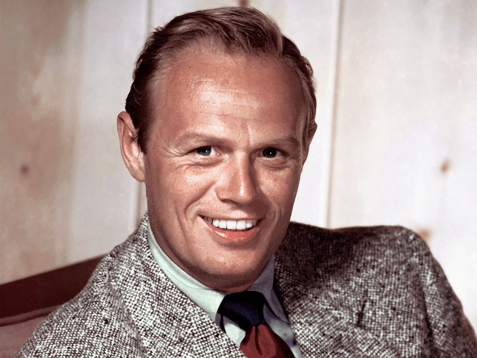 Charismatic Hollywood Icon, Richard Widmark With Wide Smile Background