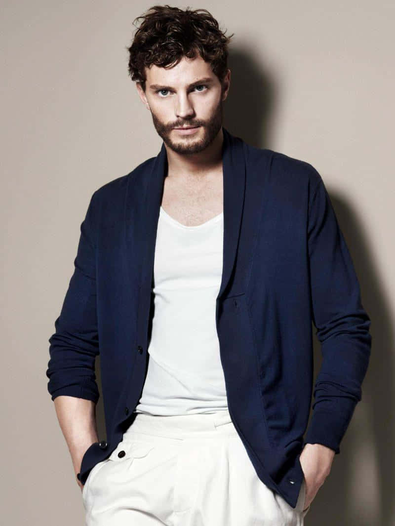 Charismatic Jamie Dornan Striking A Pose. Background