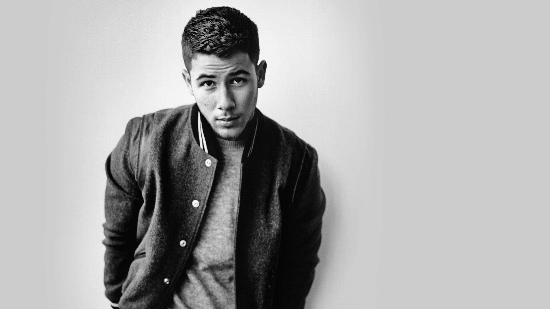 Charismatic Singer Nick Jonas Background