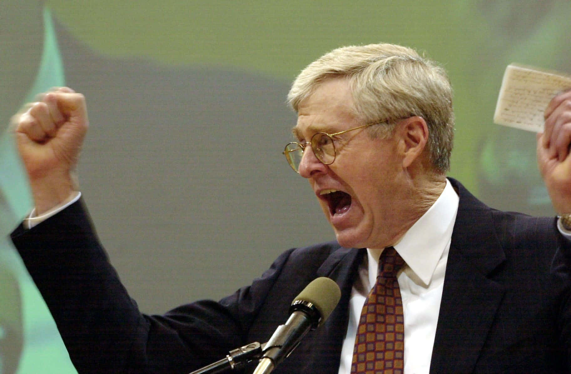 Charles G. Koch Screaming Fist Background