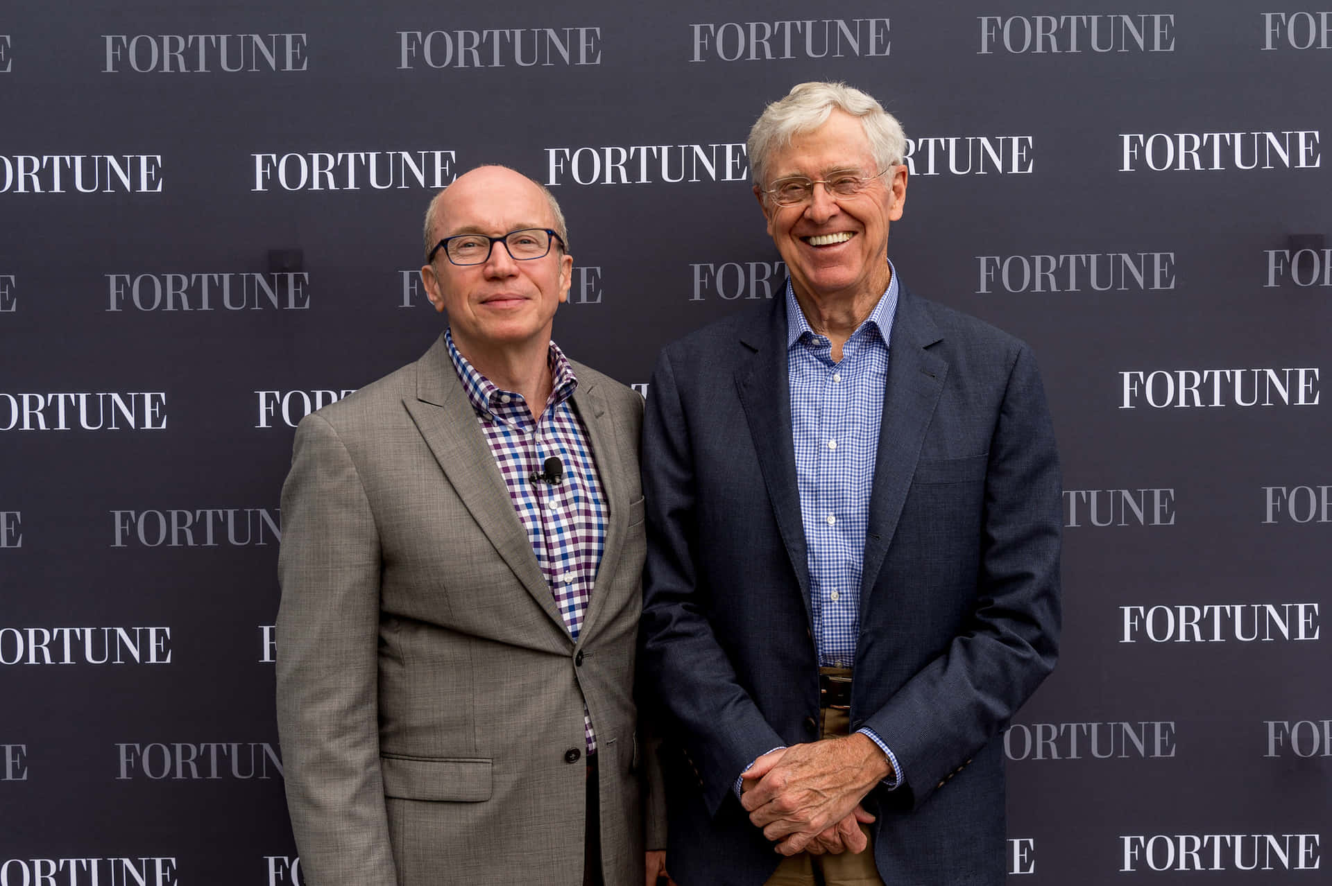 Charles G. Koch Speaking At A Fortune Event Background