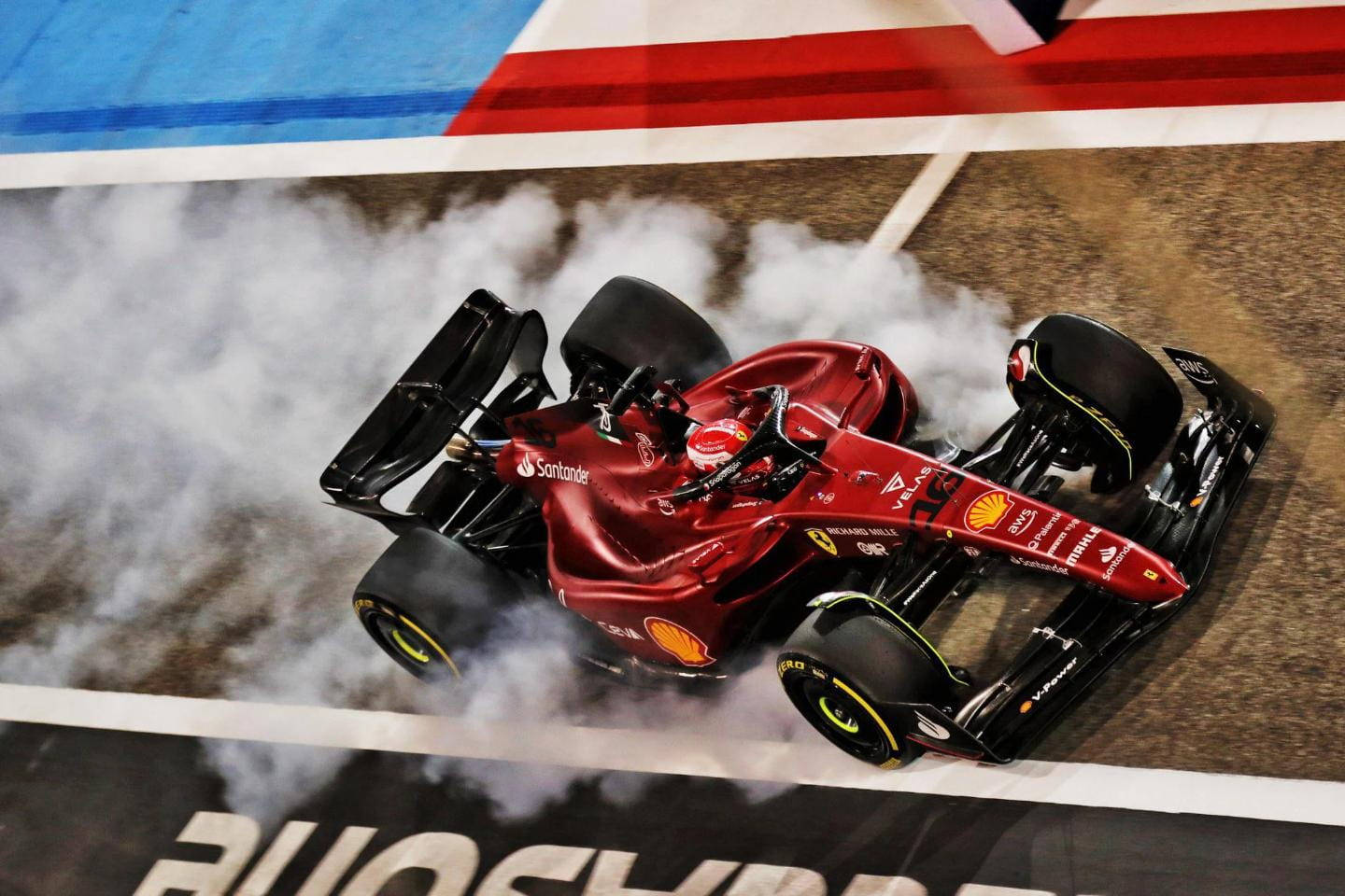 Charles Leclerc Making The Wheels Smoke Background