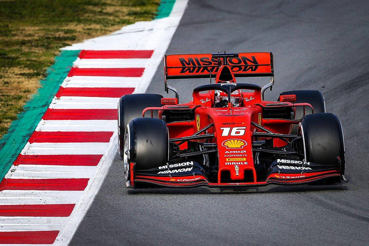 Charles Leclerc Racing Near Curb Background