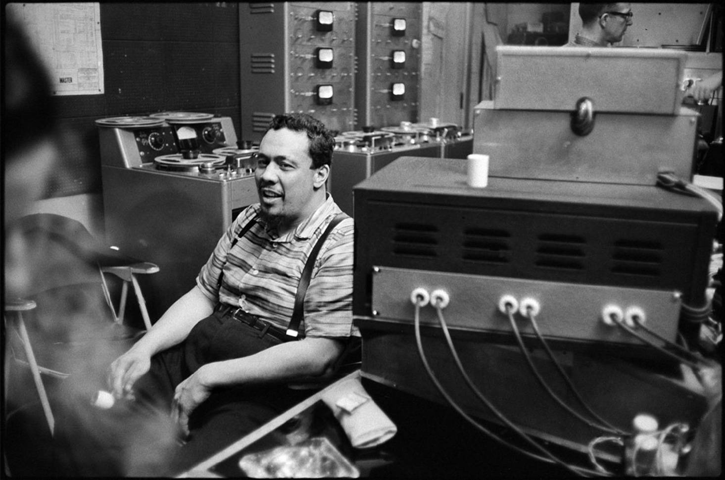 Charles Mingus In A Music Room Background