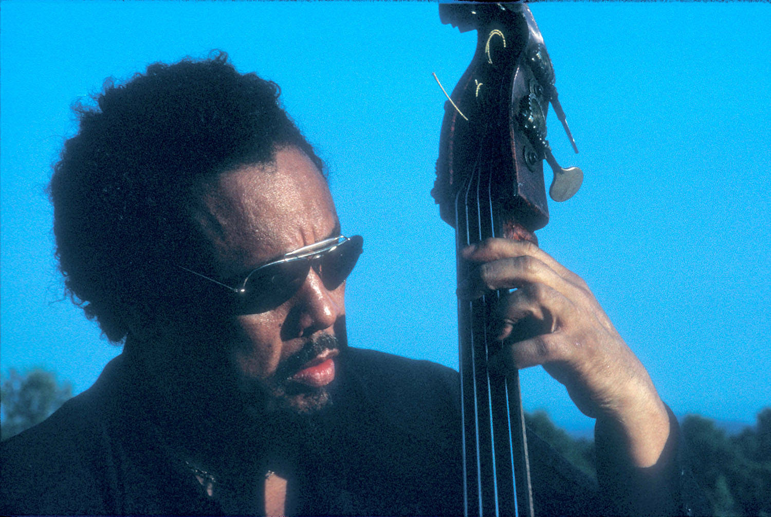 Charles Mingus On A Blue Sky Background