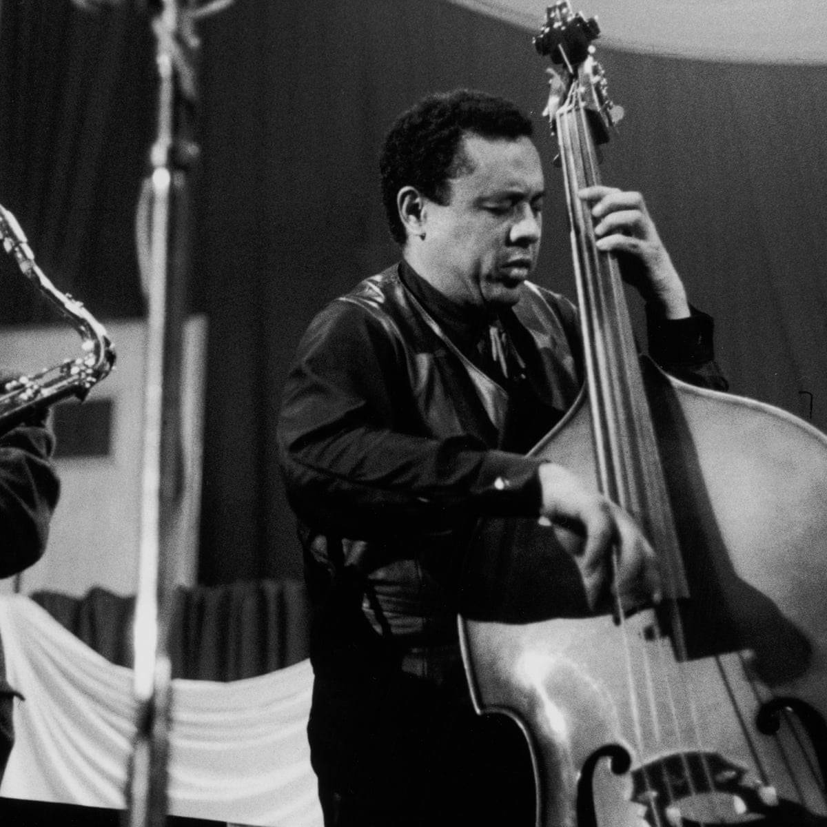 Charles Mingus Passionately Playing Guitarron Background