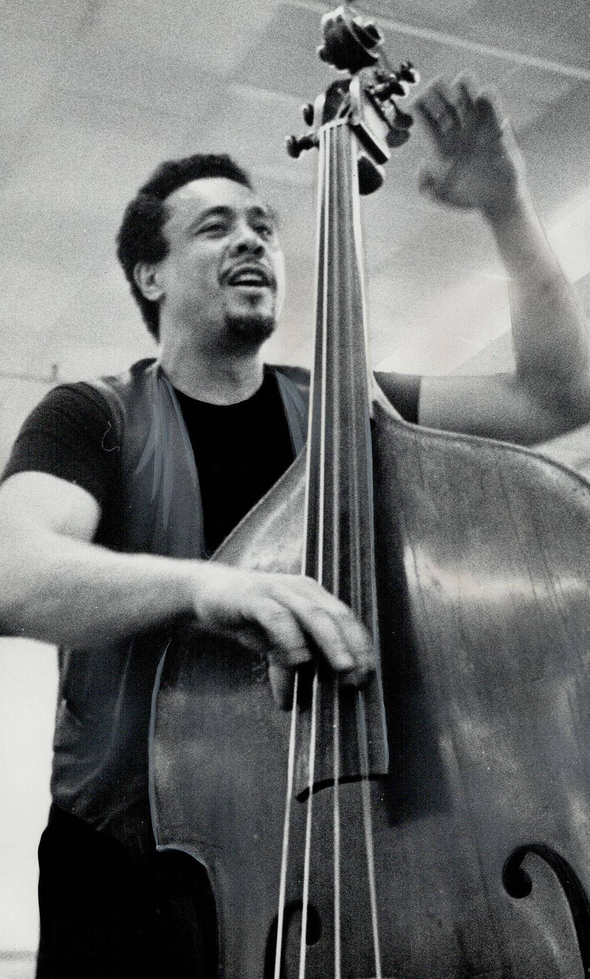 Charles Mingus Playing Huge Bass Guitar Background