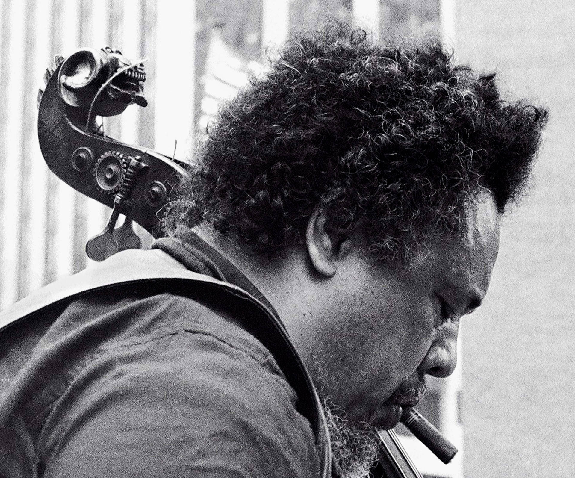 Charles Mingus Smoking While Carrying Bass Guitar Background