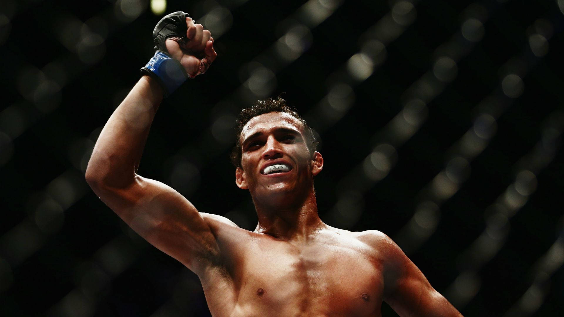 Charles Oliveira Fist Pump Victory Background