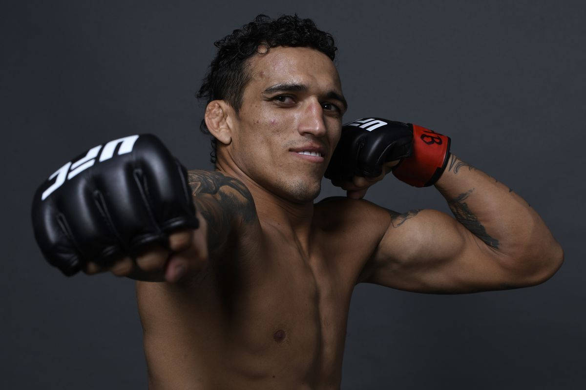 Charles Oliveira Fist Punch Background