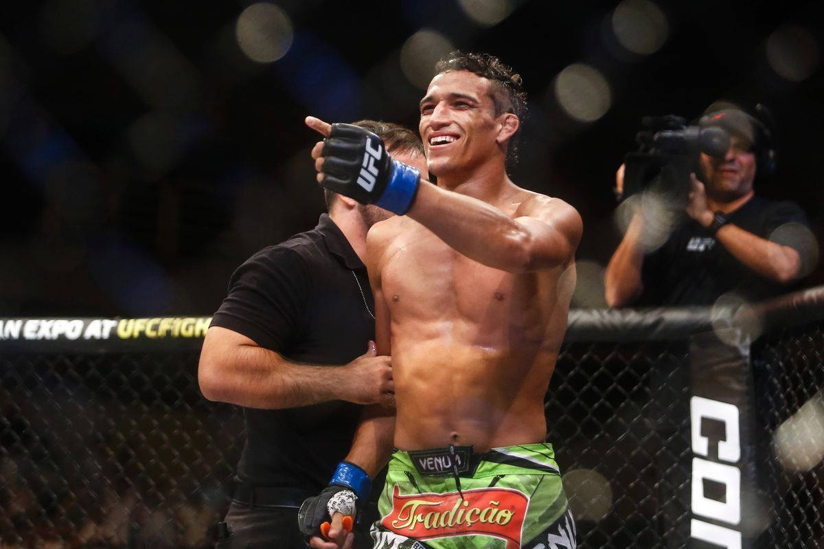 Charles Oliveira Smiling Pointing Background