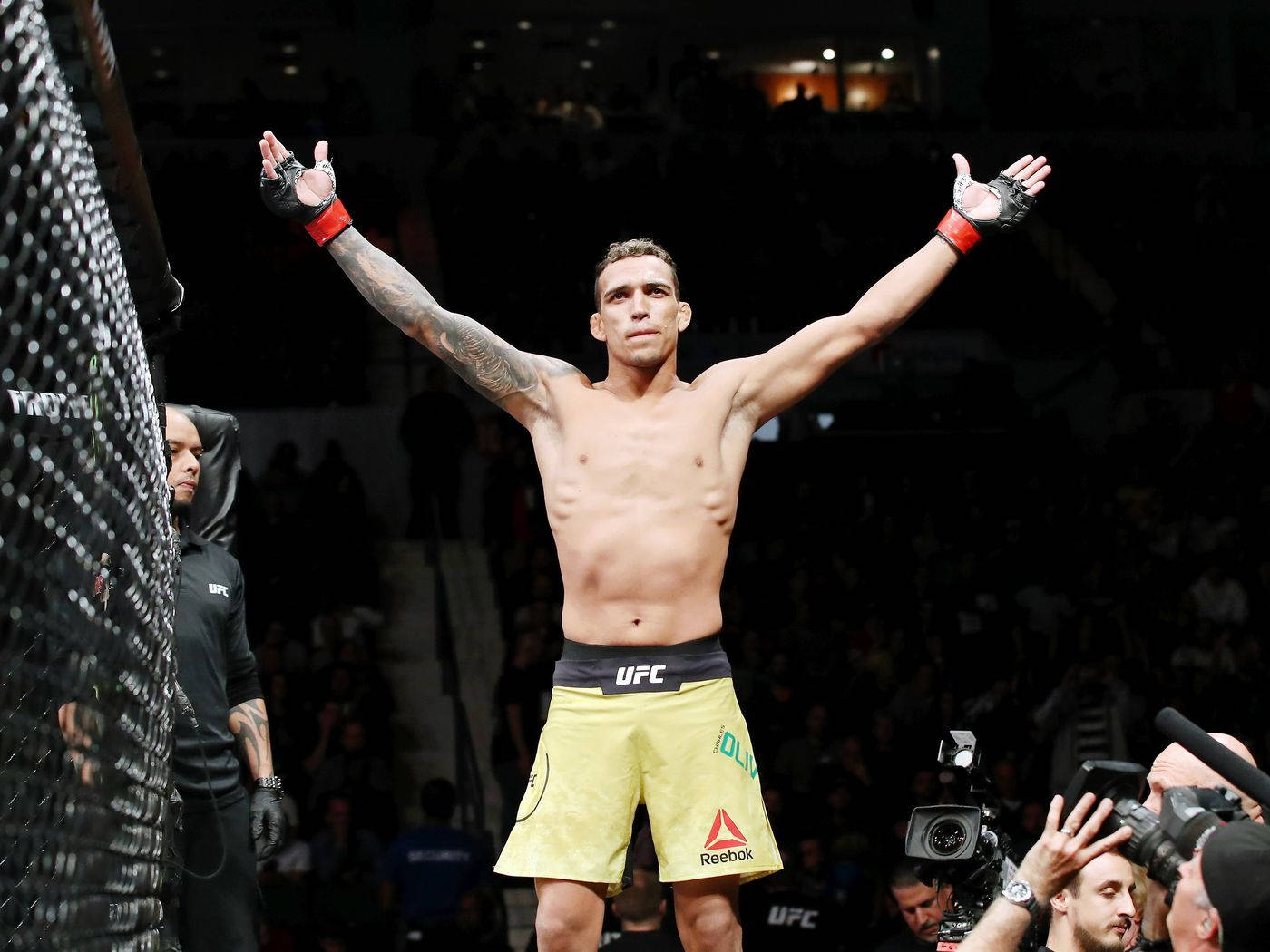 Charles Oliveira Triumphant Pose Background