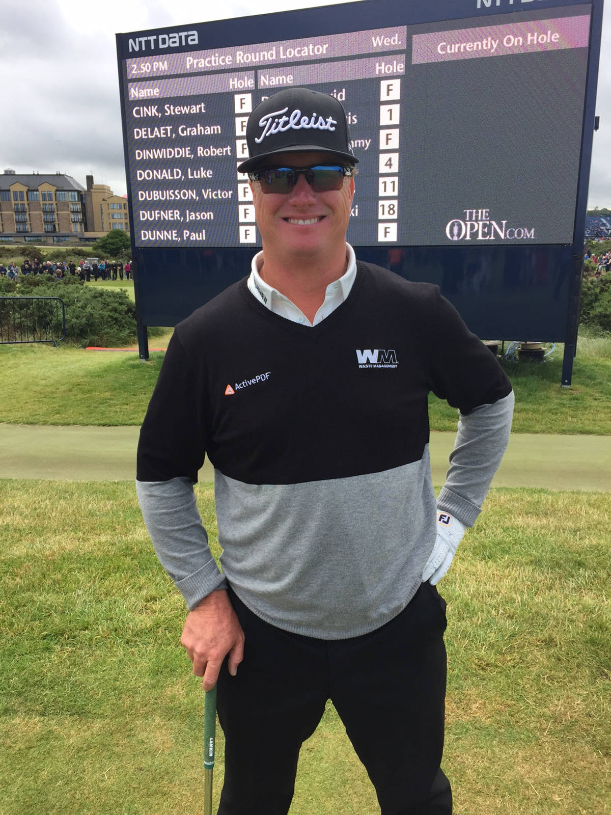 Charley Hoffman Grinning Near Scoreboard Background