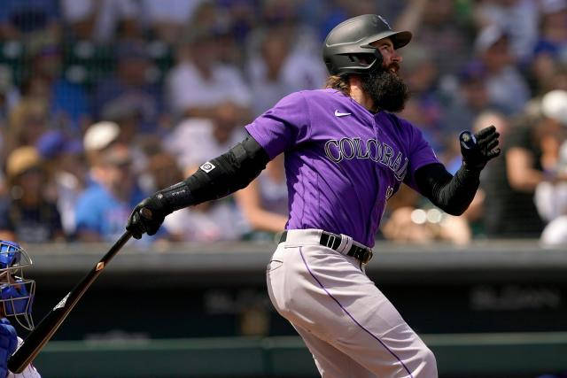 Charlie Blackmon In Action, Swinging His Bat During A Game. Background